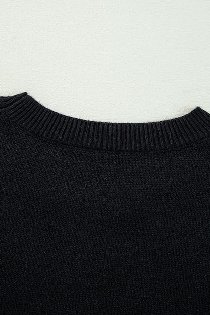 Schwarzer boo strickpullover mit geripptem rand und schultern