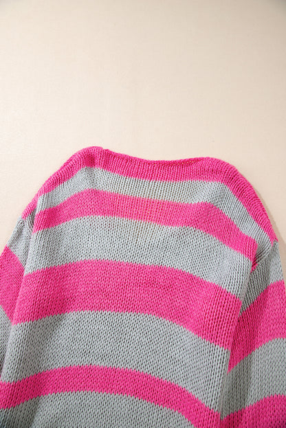 Rosa gestreifter colorblock-strickpullover mit v-ausschnitt und lockerer passform