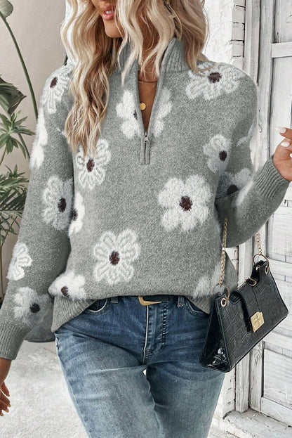 Grauer pullover mit floralem muster und halbem reißverschluss an der schulter