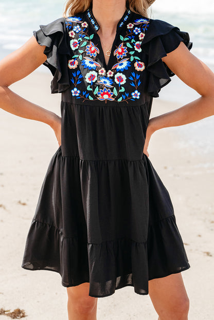 Schwarzes, mit blumen besticktes, gerafftes minikleid