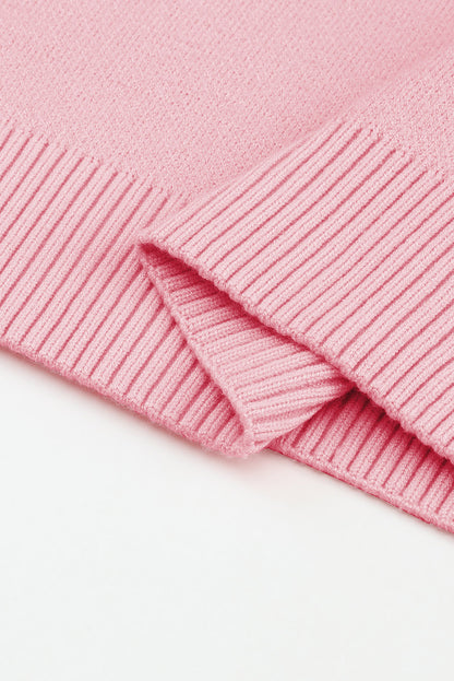 Rosa pullover mit blumenmuster und schultern