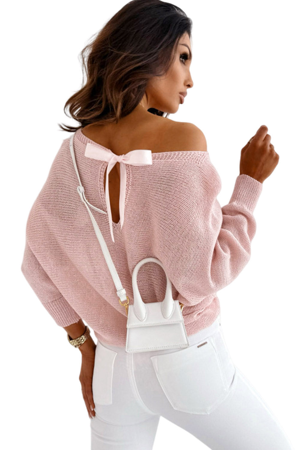Pullover mit rosa schleifenknoten und dolman-ärmeln