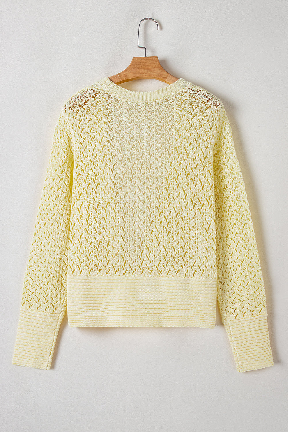 Gelbe creme pointelle-strickjacke mit offener vorderseite